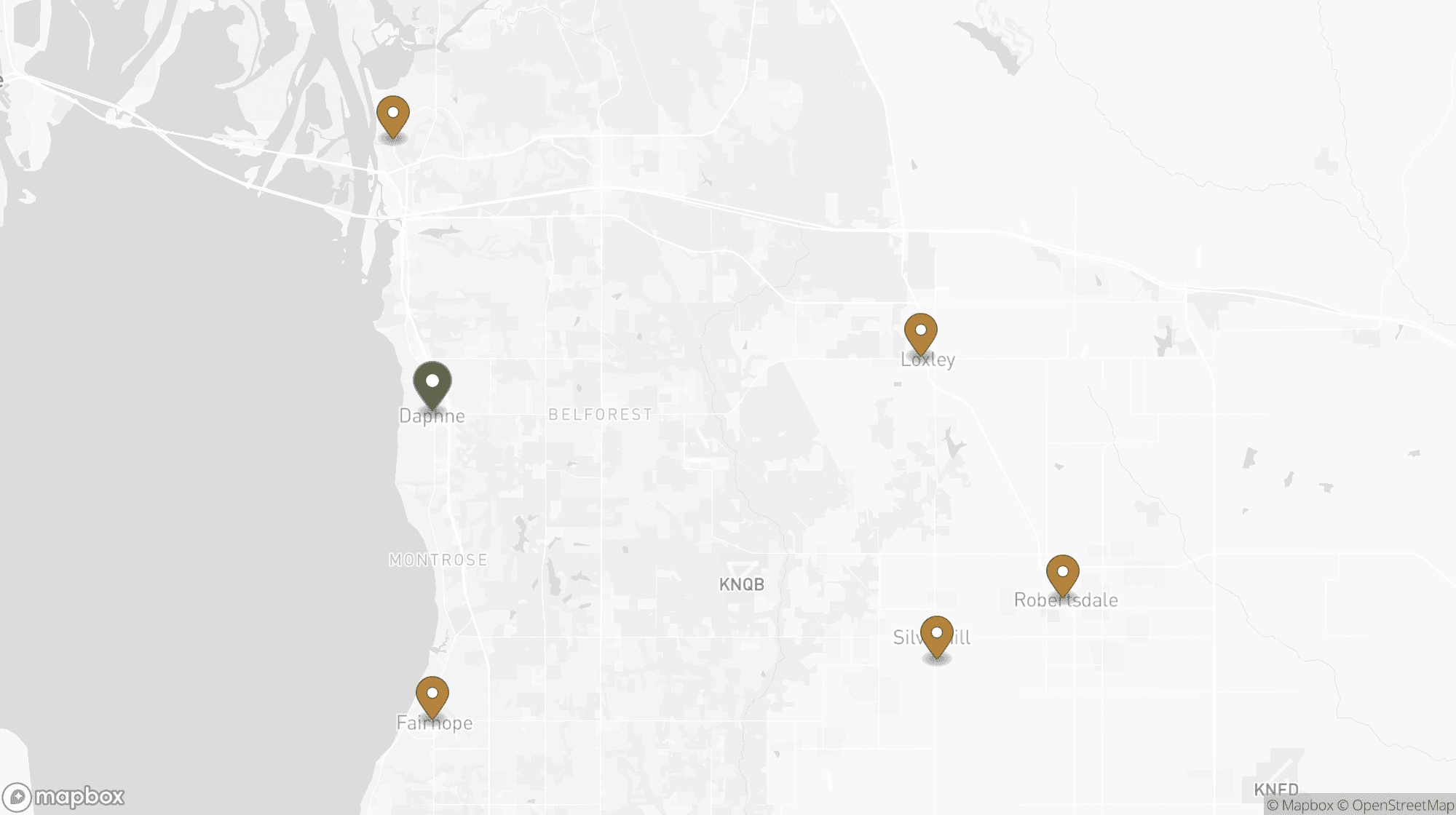 Mapa de la Costa Este y el Condado de Baldwin que muestra Blessed Barbershop en Daphne y las ciudades a las que atiende — Spanish Fort, Fairhope, Loxley, Silverhill y Robertsdale